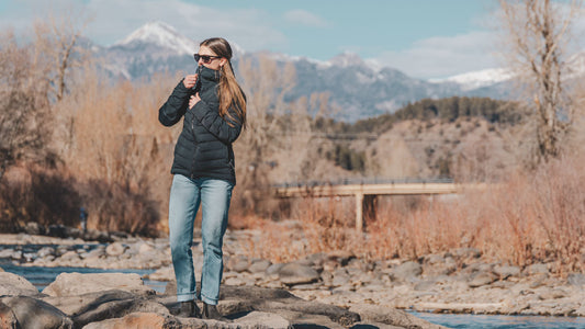 Lady wearing VOORMI Black Puffy next to the river
